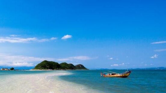 A boat floating by the beach at Nha Trang, Vietnam