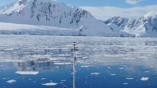 Cruising past icebergs in the Antarctic
