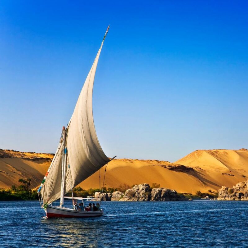 Felucca Nile cruise Egypt, Aswan, Felucca, Boat, Cruise, Desert, Diune, Landmark, Landscape, Nil, Outdoors, Panoramic, River, Sailing, Scenic, Sky, Skyline, Traditional Culture Egypt. The Nile at Aswan