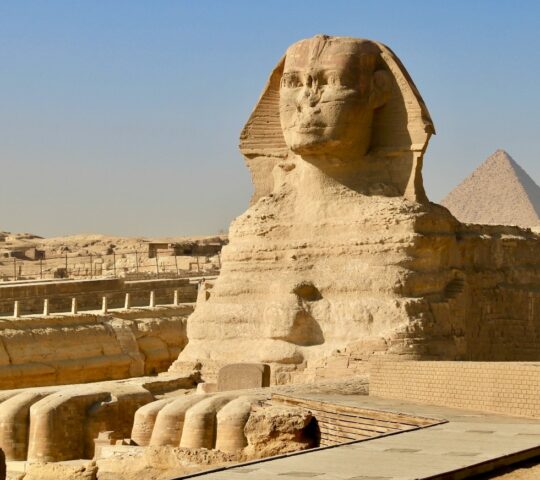 Standing before the Great Sphinx of Giza, guardian of the pyramids