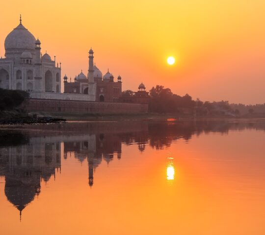Changing hues of the sun around the Taj Mahal