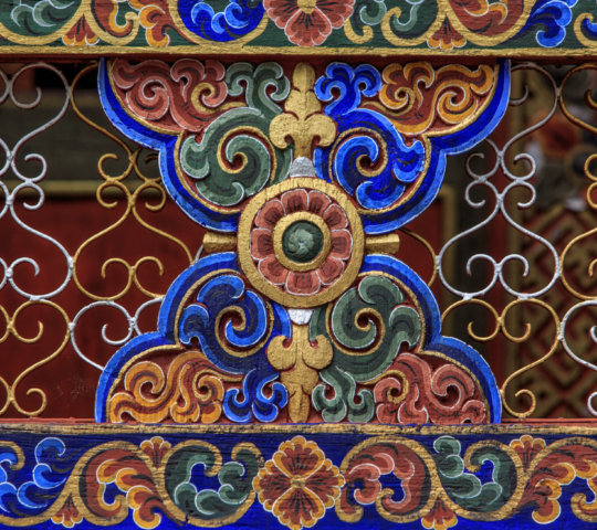 An intricate Bhutanese metalwork, showcasing detailed patterns and craftsmanship
