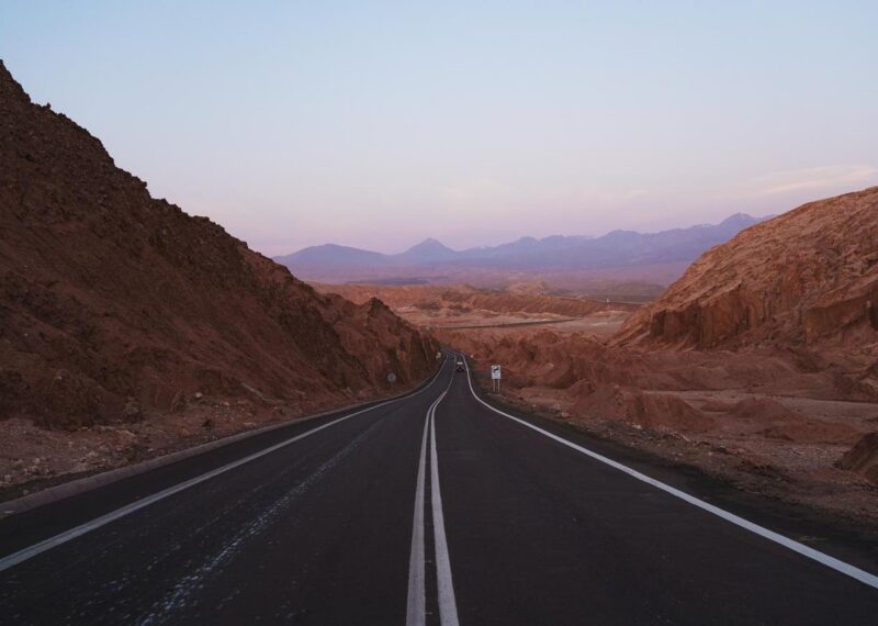 Landscape shot during sunset of road crossing mountains in Atacama desert, Chile