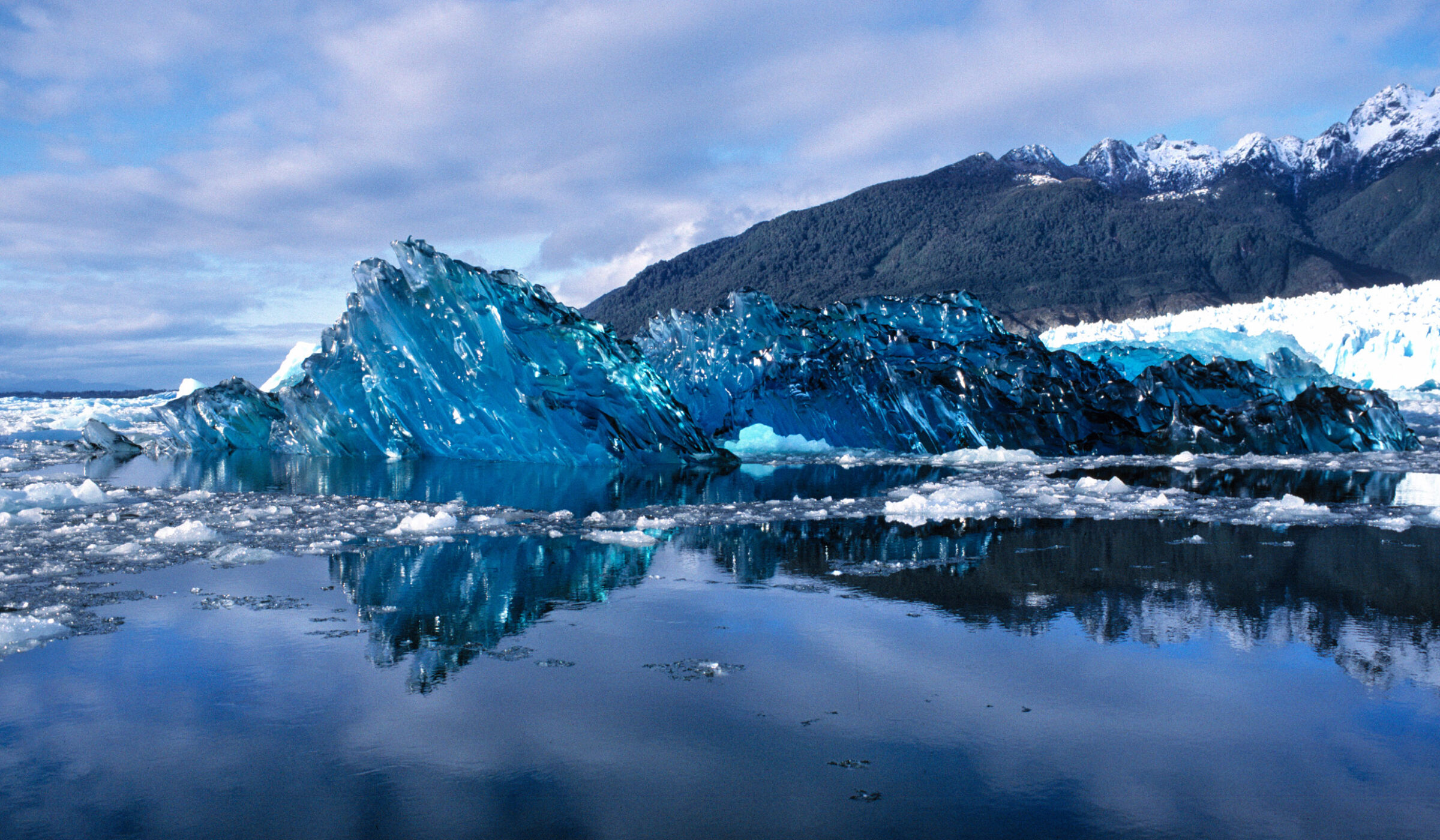 The underside of a newly-calved iceberg looks like blue, scalloped glass in San Rafael Lagoon NP, Chile.