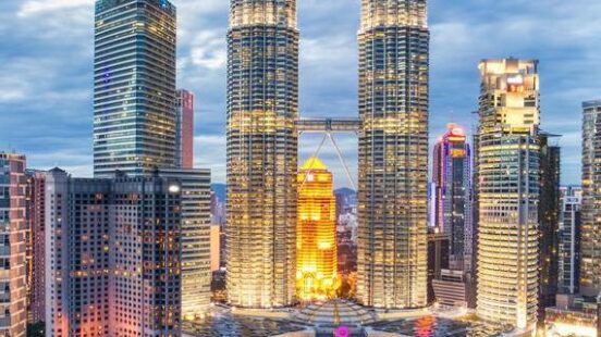 Skyscrapers in the Kuala Lumpur skyline at dusk