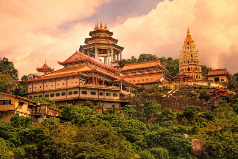 The ornate Kek Lok Si Temple complex sits on a lush hillside during luxury Malaysia vacations.