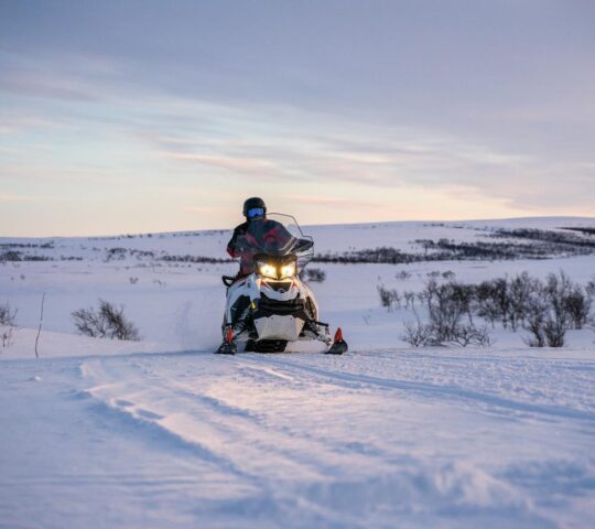 Zoom across the snow on a snowmobile tour