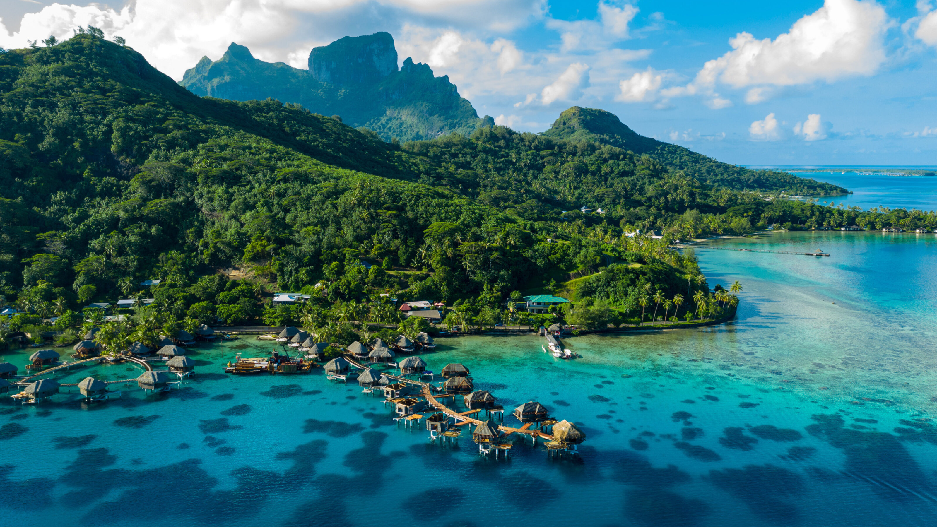 Bora Bora aerial drone image of travel vacation paradise and overwater bungalows