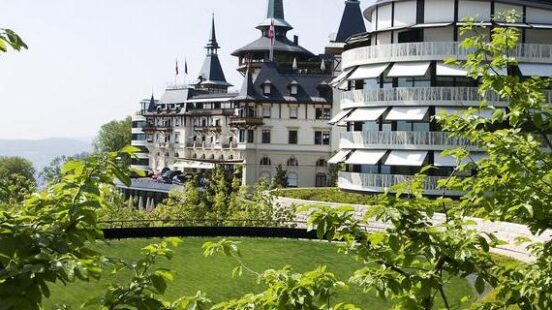 The Dolder Grand hotel in Switzerland surrounded by greenery