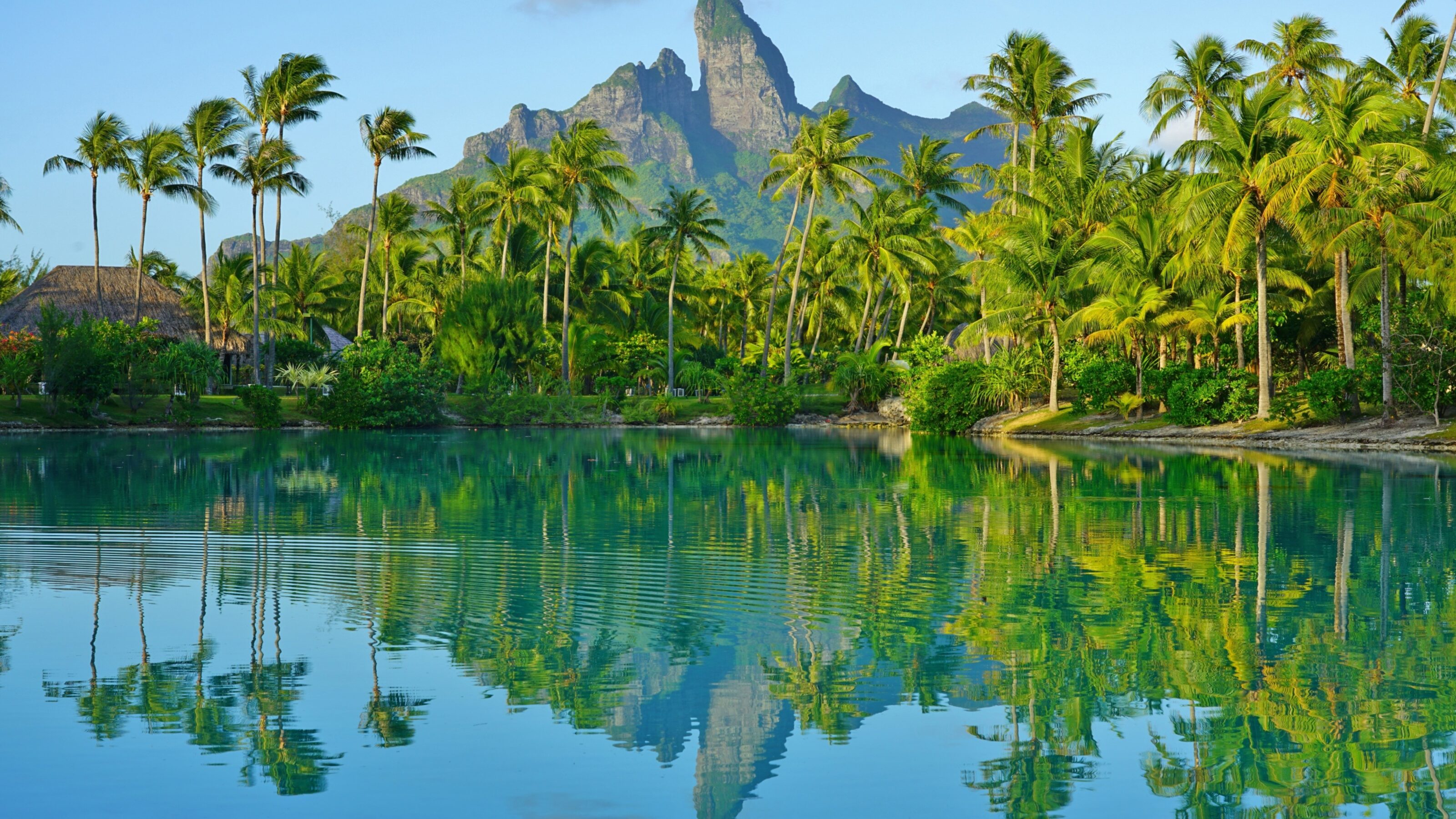 View of the Mont Otemanu mountain reflecting in water at sunset in Bora Bora, French Polynesia, South Pacific