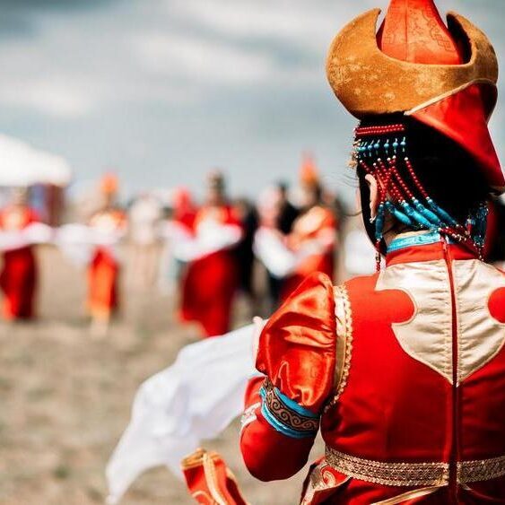 Photo of young beautiful women wearing in traditional national mongolian kalmykian dresses in the festival Photo of young beautiful women wearing in traditional national mongolian kalmykian dresses in the festival. yurt, nomad, mongolian, woman, culture, accessories, asia, beads, century, city, clothing, colorful, copy, costume, dance, decoration, detailed, dress, empire, ethnic, fashion, female, festival, folklore, genghis, girl, hat, khan, kalmykia, mongol, mongolia, national, native, outfit, people, space, style, symbol, symbolic, temple, traditional, unique, white, young, red, clouds, field, spring, early Mongolia
