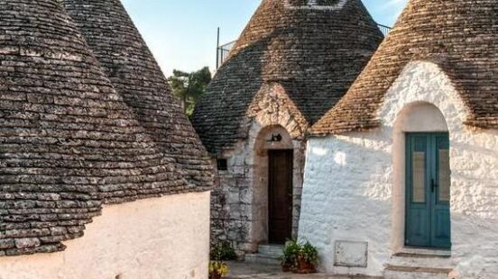 Traditional Trulli houses with conical roofs in Alberobello, Italy.
