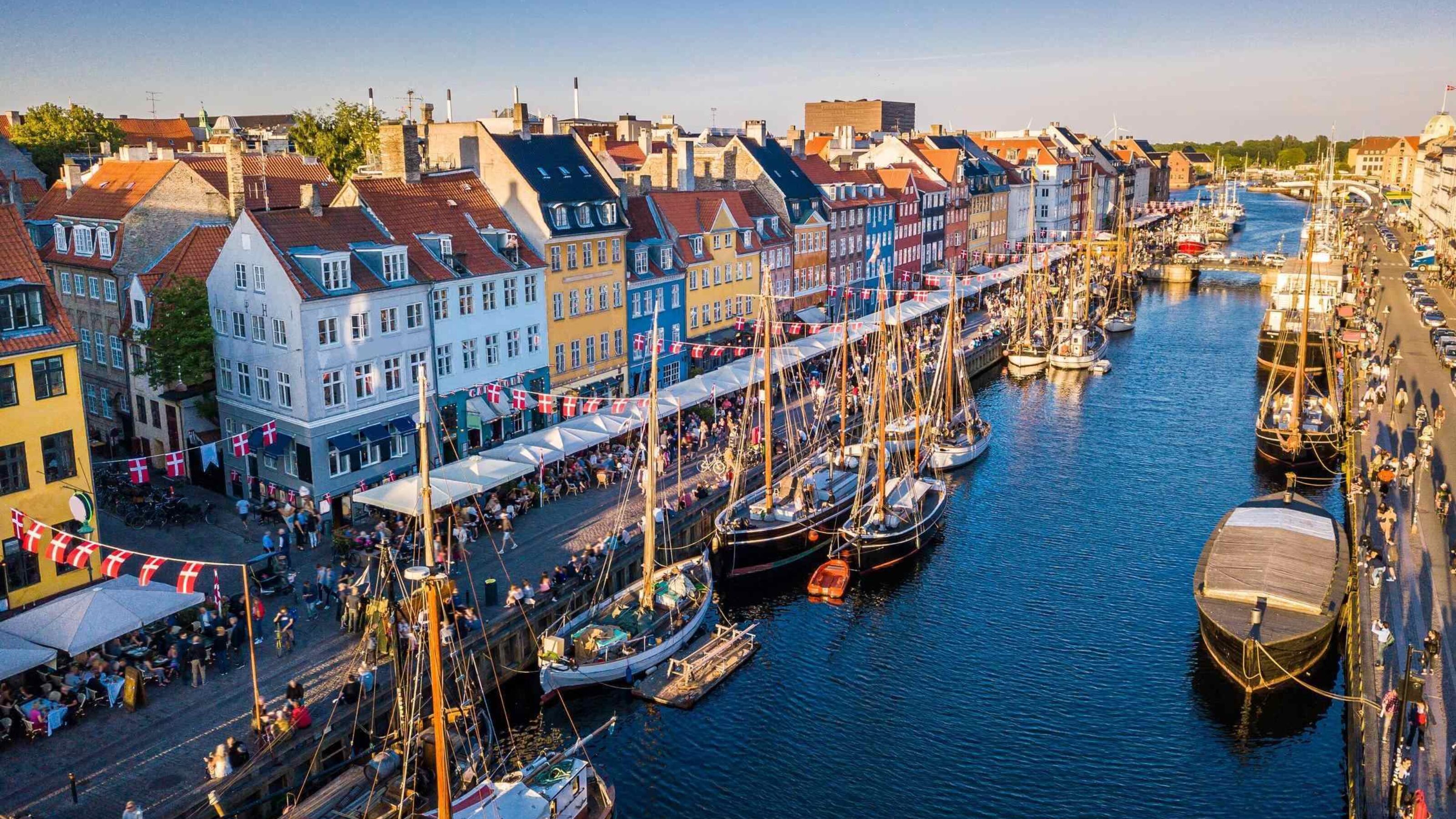 A canal with boats harboured in Copenhagen, Denmark