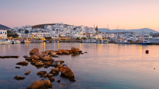 Sunset over Paros island, Greece, highlighting the peaceful coastline.