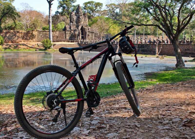 Bicycle in front of stone Gate of Angkor Thom in Cambodia