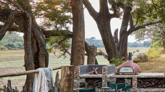 The pool area of one of KuKayax27;s private villas overlooking the Luangwa River.