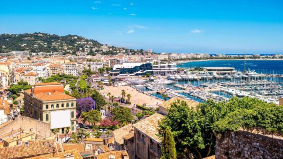 French riviera in Cannes city with yachts in the harbour