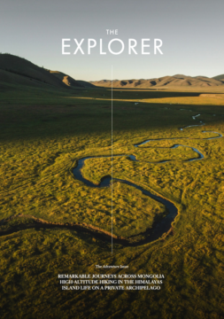 The front cover of The Explorer, Issue 17 (adventure). A river winding through the vast Mongolian landscape.