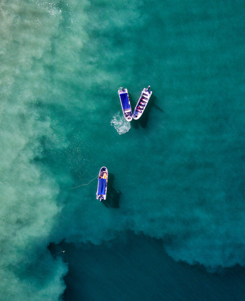 Aerial drone photo of three fishing boats in the Pacific Ocean, off the coast of Costa Rica