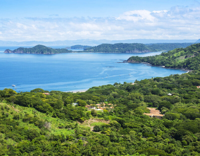 A photograph of the small town of Playa Hermosa, Guanacaste, Costa Rica, in Central America. Over looking the Golfo Papagayo and the Pacific Ocean