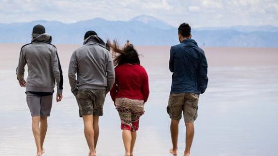 family walking in Salinas Grandes, Argentina