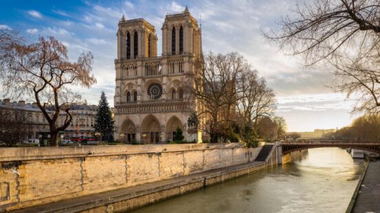 Morning view of Notre Dame de Paris Cathedral on Ile de la Cite. The Seine River and the Cathedral are seen in soft winter light. Paris, 4th arrondissement, France.