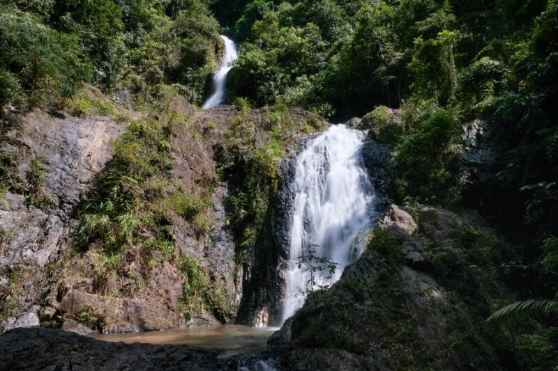 Two cascades of Huay Tho waterfall on sunny day. Khao Phanom Bencha National Park, Krabi Province, Thailand.
