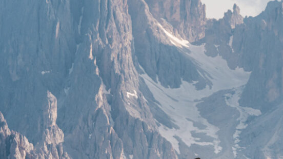 Couple hiking the Dolomites Alps Italy