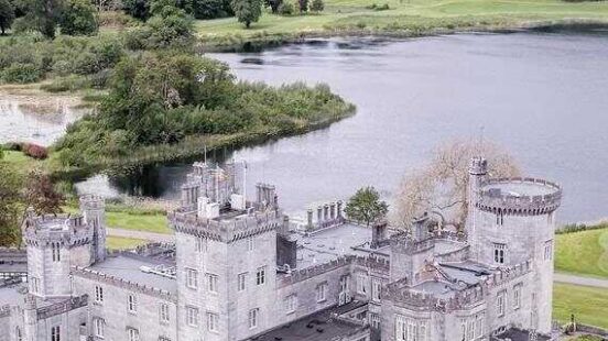 An aereal shot of Dromoland Castle with loch in the background