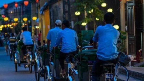 Night view of busy street in Hoi An, Vietnam.