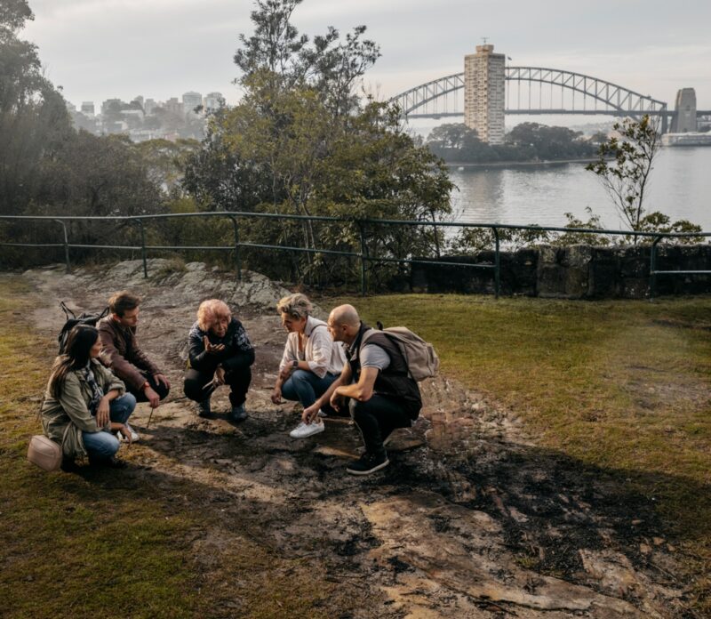 Group enjoying a Dreamtime Southern X tour with Marget Campbell at Balls Head, Waverton in Sydney.