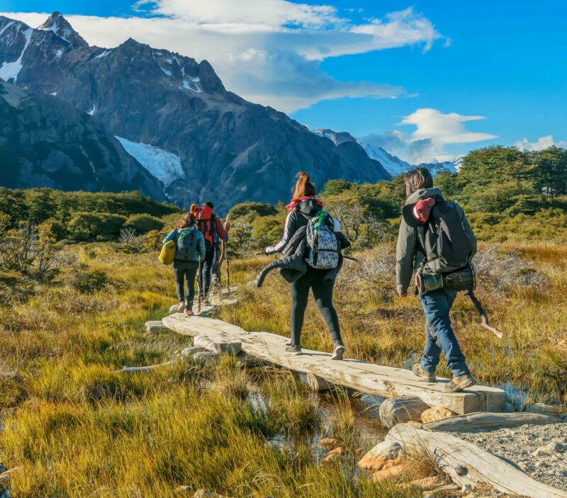 Backpackers walking towards the mountain on a luxury Patagonia holiday
