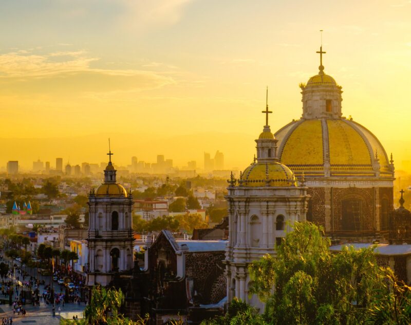 Scenic view at Basilica of Guadalupe with Mexico city skyline at sunset, Mexico