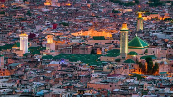 Aerial view of the medina in Fes, Morocco, lit up at dusk