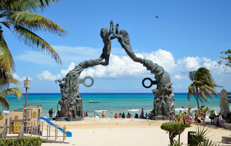 Portal Maya Mayan Gateway bronze sculpture in Parque Fundadores, on the waterfront at Playa del Carmen, Mexico