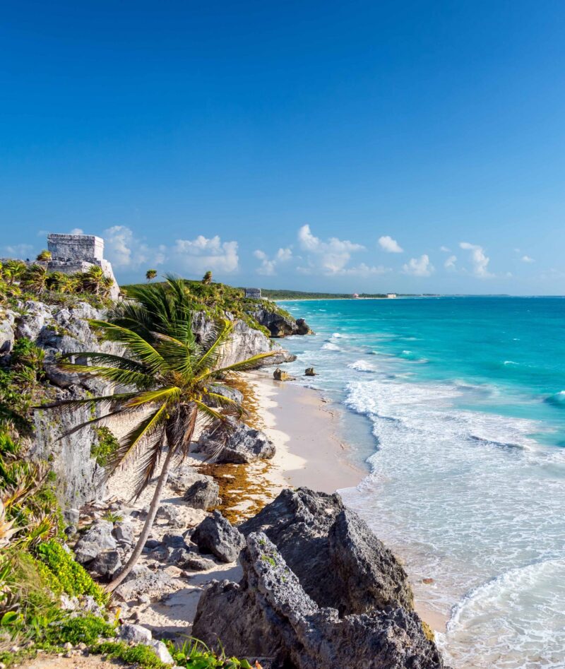 Wide angle view of the beautiful Caribbean Sea and the ruins of Tulum, Mexico