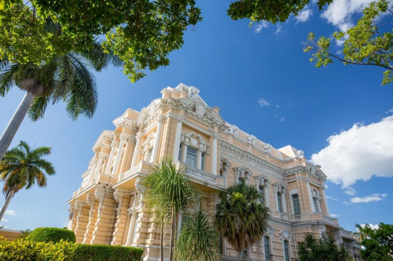 The Canton Palace fringed by palm trees in Mérida, Mexico