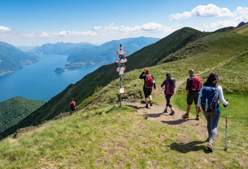 Trekking scene on Lake Como alps (the arrows indicates the names of the locations reached by the trails)