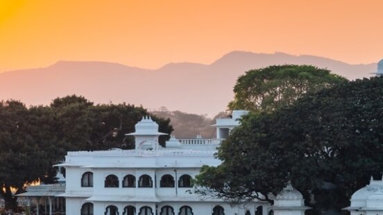 Sunset Pichola lake and Udaipur old town in India