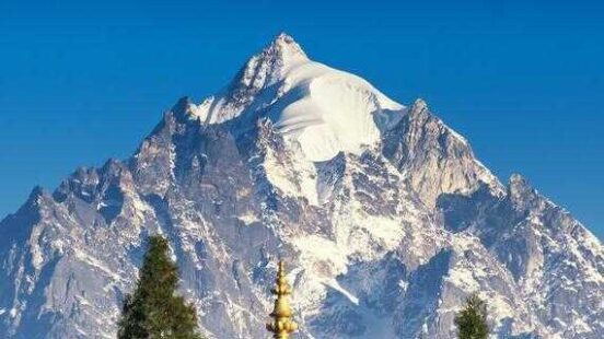 Mount Pandim, one of the highest peaks of Himalayan Mountain range with top of Rinchenpong Monastery in foreground, clear blue Adobe Stock ID: 477069929