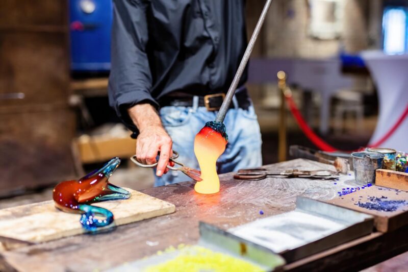 A glass blower making glass in Murano, Venice