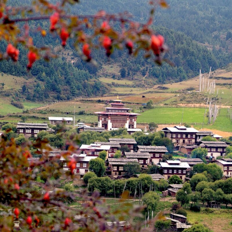 Bhutan, mountain village Ura with homes and traditional Dzong