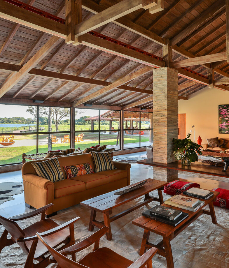 The clear waters of the private beach at Ponta Dos Ganchos and the rustic main lodge at Casa Caiman.