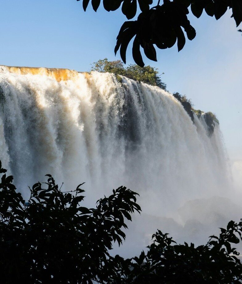 The spectacular view of Iguaçu Falls making you feel extremely small and the beaches of Fernando de Noronha during sunset.