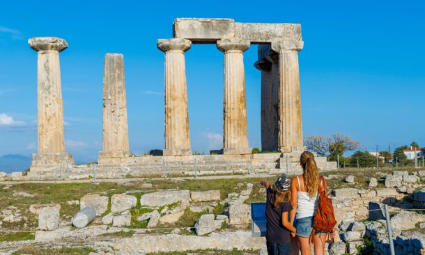 Standing before the monumental ruins of Corinthx27;s Temple of Apollo – Greecex27;s living history.