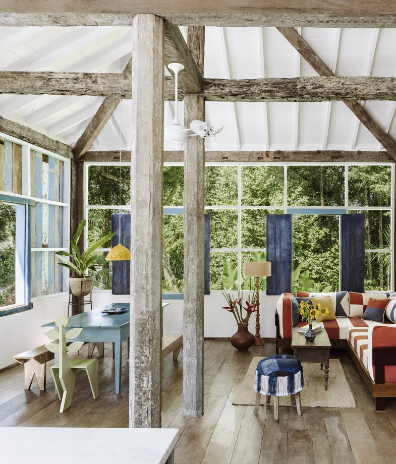 The open-plan living space at Casa Azul, one of the private villas at UXUA Maré in Trancoso, and the stunning ocean views from Txai Resort.