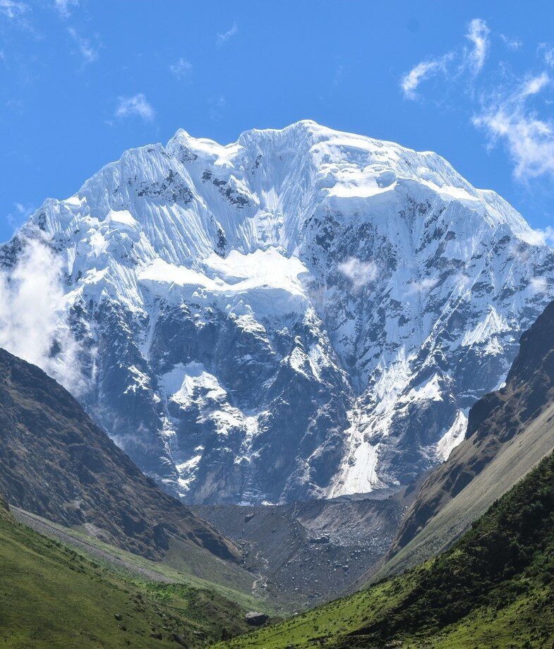 The raked stone paths of the Inka Trail and the towering snow-capped peaks of the Salkantay Trek in Peru.