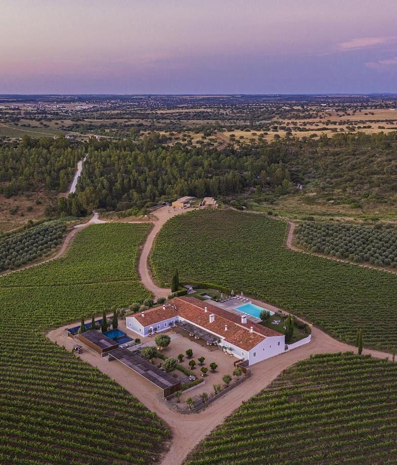 The stylish interior of Stamba Hotel in Tbilisi and the vineyard-surrounded estate of Herdade da Malhadinha Nova in Alentejo region.