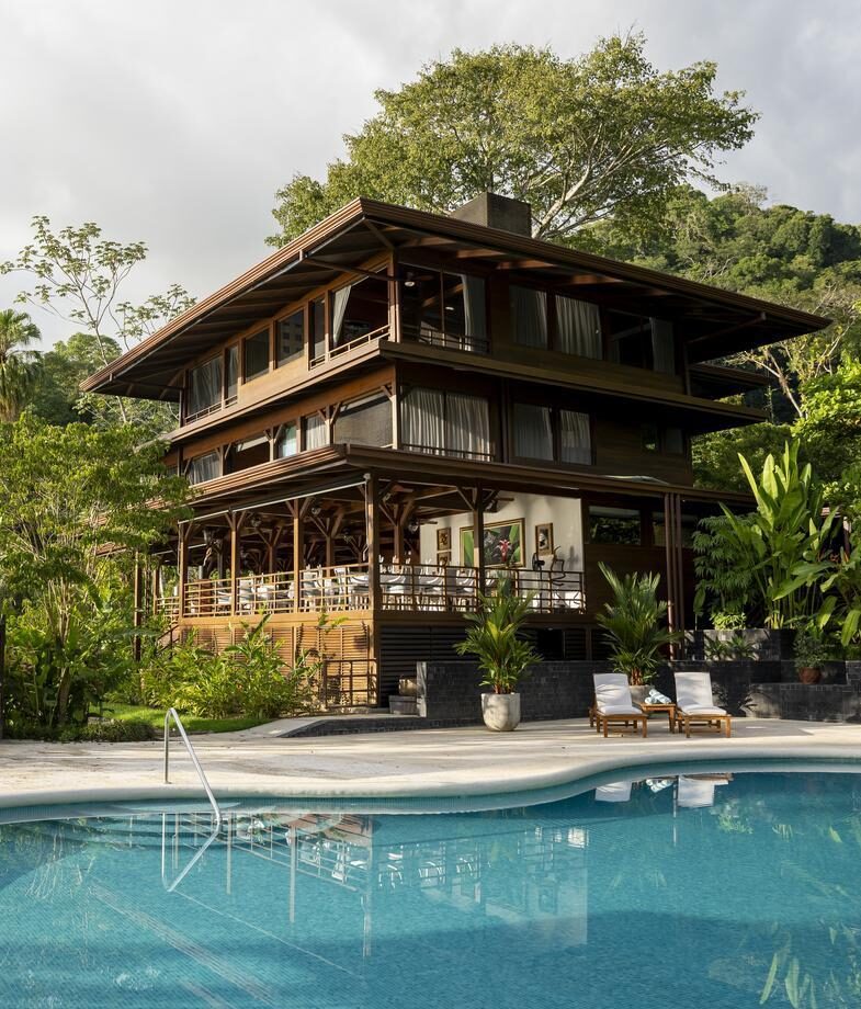 Kayaking through Tortuguero National Parkx27;s jungle canals and the main building and pool area at Playa Cativo Lodge on the Osa Peninsula.
