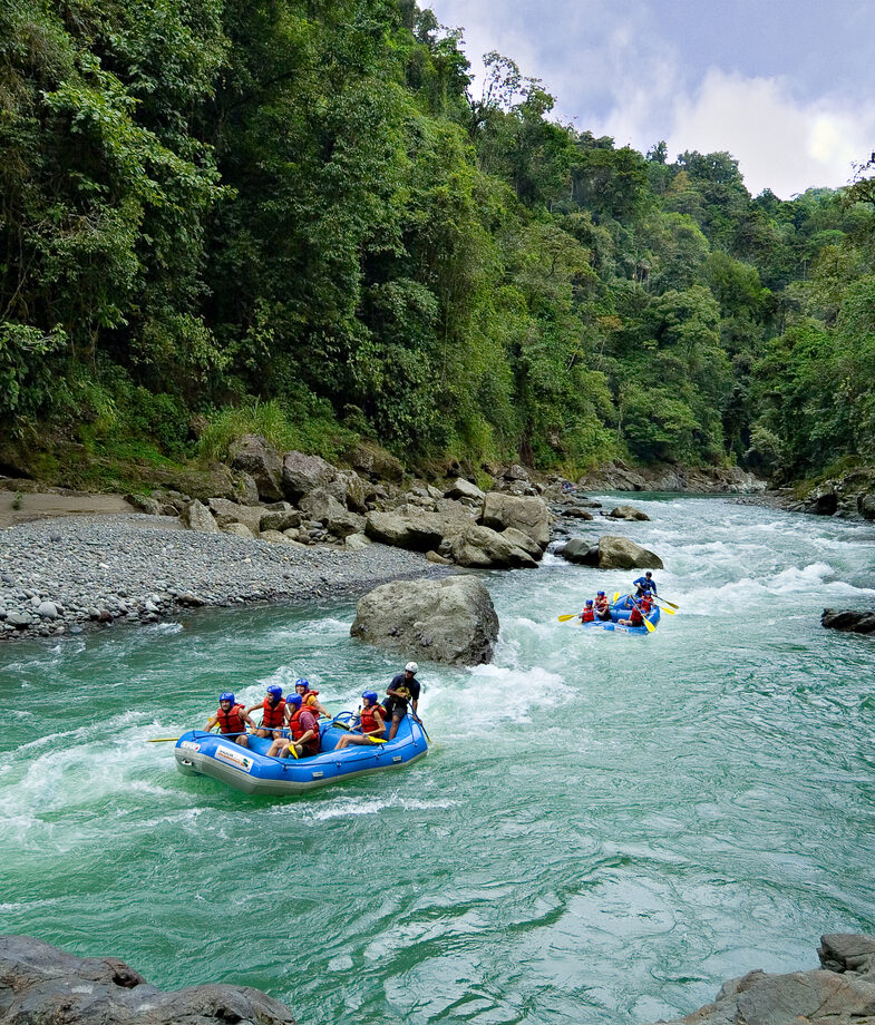 Rafting through the rainforest rapids of the Pacuare River and the ocean-view balcony at Arenas del Mar in Manuel Antonio at sunset.